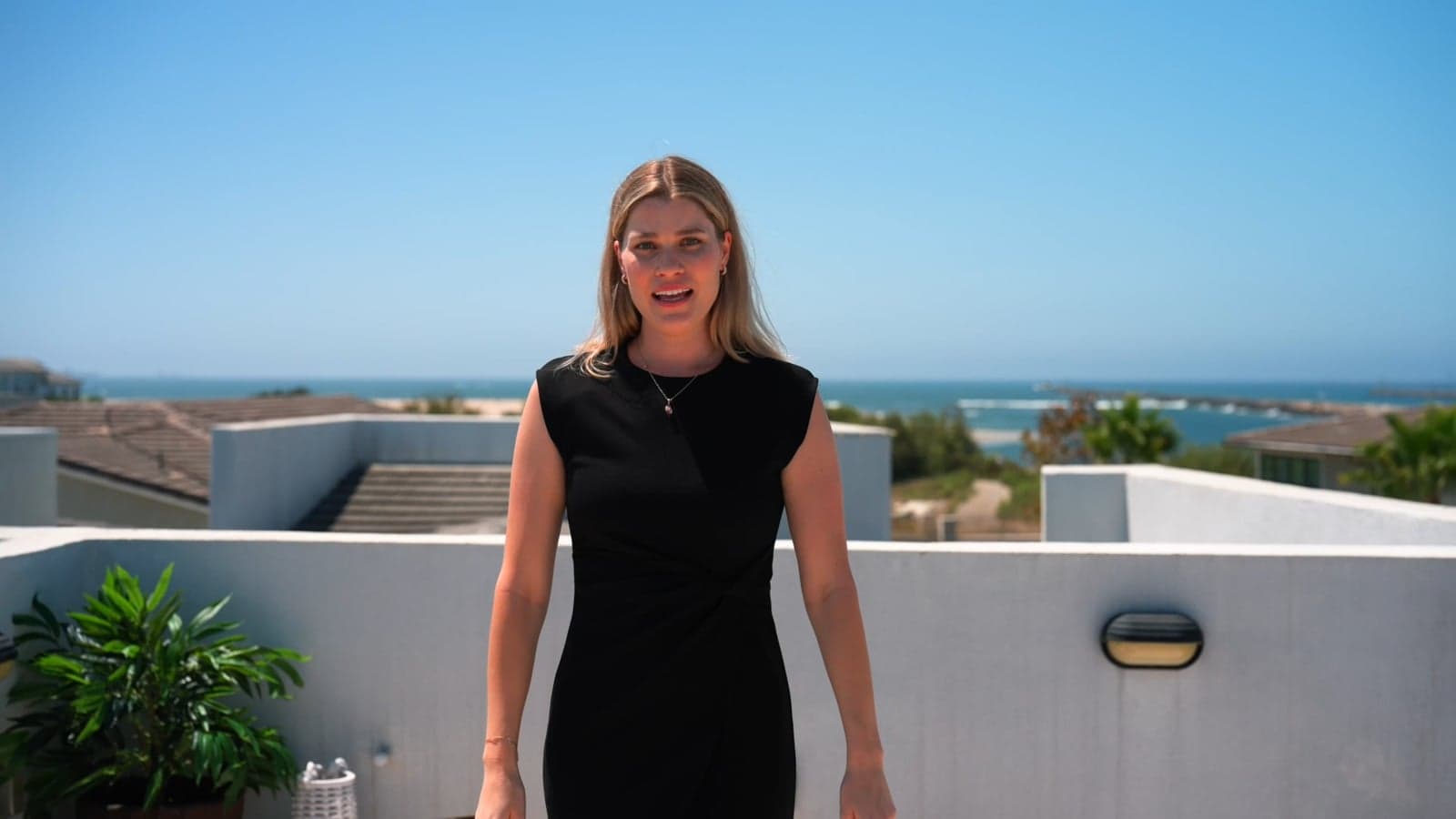 Video thumbnail of an agent presenting on a rooftop deck overlooking the ocean at 208 Ocean Place