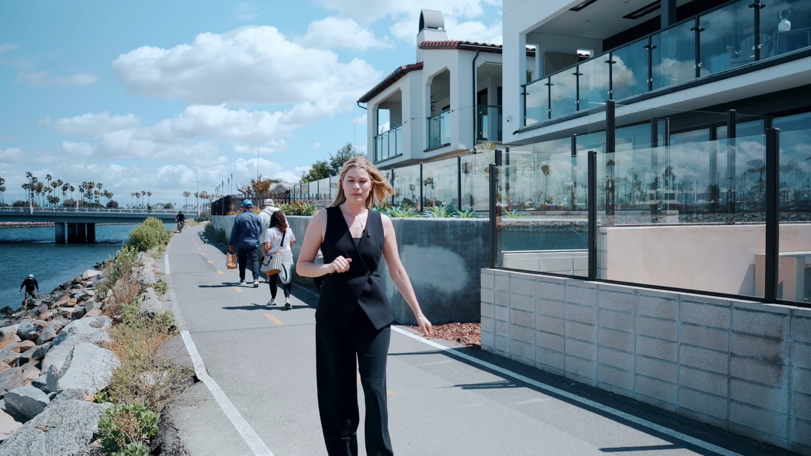 Video thumbnail of an agent walking the waterfront path in front of 205 Ocean Place