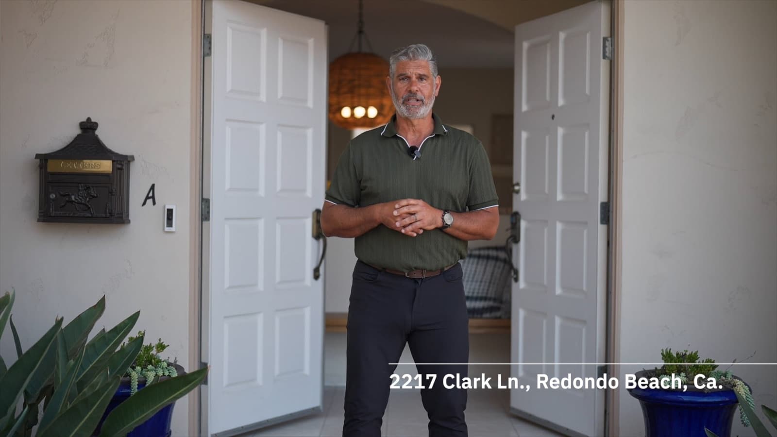 Video thumbnail of an agent presenting at the entrance of 2217 Clark Ln